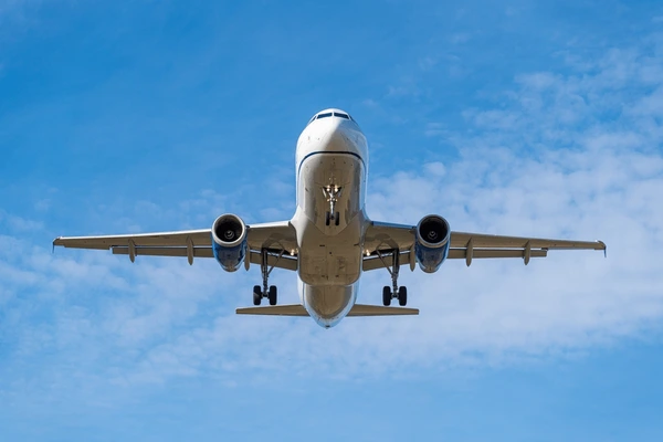 front view commercial airplane approaching 600nw 2619126421